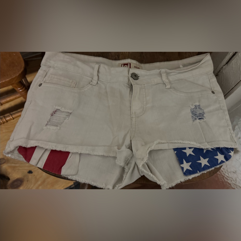 Sold 
Women’s LEI white red and blue  star shorts size 11 juniors